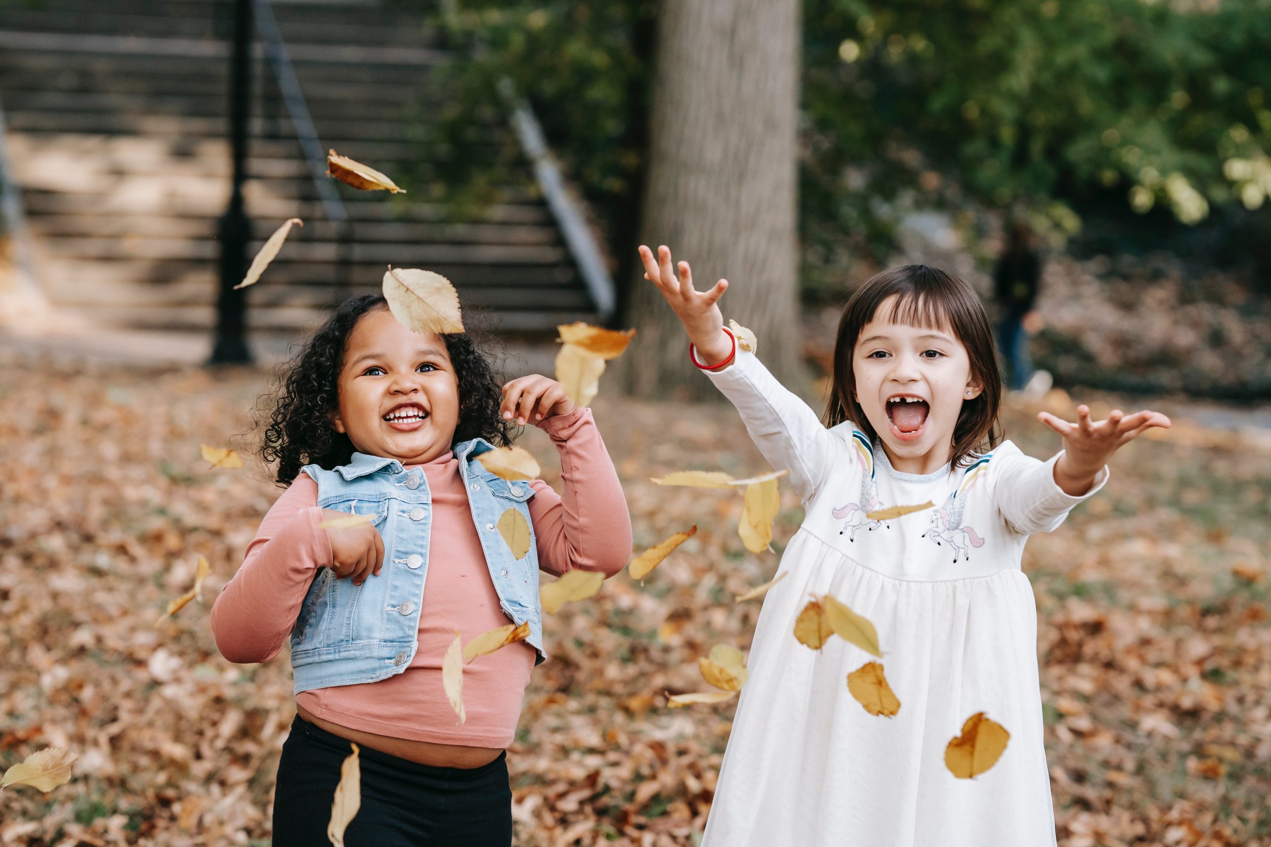 happy girls with leaves
